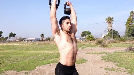 Functional-training-with-kettlebell-outdoors-and-bare-chested