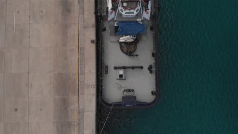 Boats-moored-at-harbor.-Aerial-top-down-forward