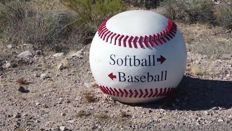 A-large-baseball-is-used-as-a-directional-sign-for-baseball-and-softball-fields,-Papago-Park,-Papago-Sports-Complex,-Phoenix,-Arizona