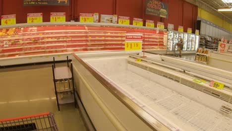 Nearly-empty-meat-shelves-at-HEB-grocery-store-that-implemented-purchase-limits-and-reduced-hours-manage-food-shortages-after-devastating-Winter-Storm
