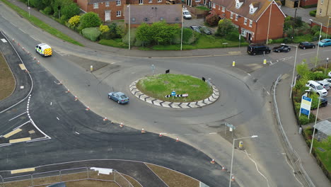 Static-aerial-view-of-a-UK-police-van-crossing-a-roundabout