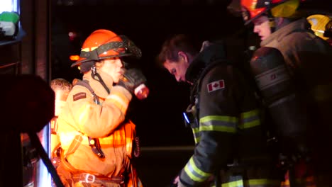 Canadian-firefighter-with-oxygen-bottle-after-emergency-operation