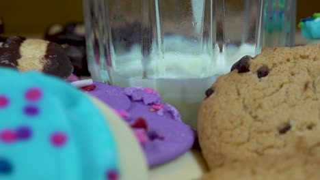 Slow-Motion-Of-Milk-Pouring-Surrounded-By-Tasty-Cookies