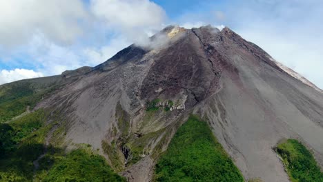 Majestic-Mount-Merapi-volcano-cone-in-clouds-on-Java,-Indonesia,-aerial-view