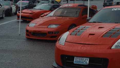 Red-Nissan-Drift-Cars,-Presented-at-Auto-Show,-Slow-Motion