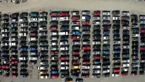 Aerial-drone-view-over-a-junkyard-full-of-scrapped-cars