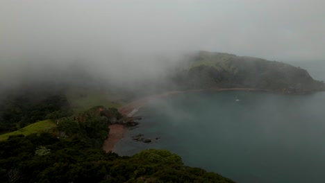 Rangihoua-Bay-Covered-In-Fog-In-The-Morning-At-Purerua-Peninsula-In-Bay-of-Islands,-Northland,-New-Zealand