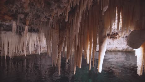 Bermuda-Crystal-and-Fantasy-Caves-stalactites-with-subterranean-walkway-close-up