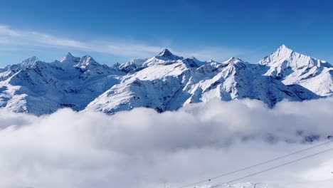 incredibly-beautiful-snow-covered-mountains-rise-above-the-sea-of-fog-in-switzerland