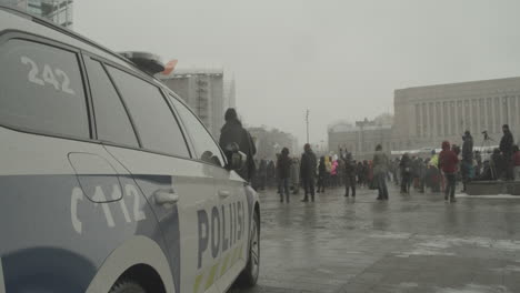Close-up-of-right-side-of-police-car-parked-near-protest-in-front-of-Helsinki-Parliament