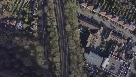 Top-down-drone-shot-of-Suburban-UK-train-tracks-Watford