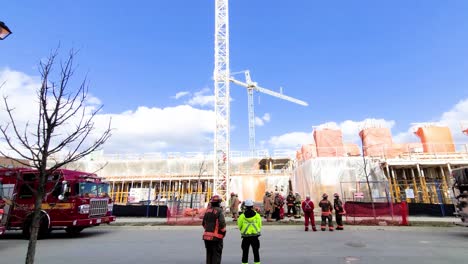 Fire-Fighters-standing-outside-of-a-construction-site---rotating-shot