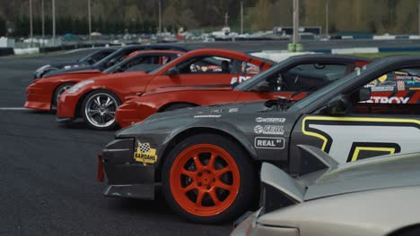 Luxury-Drift-Sports-Cars,-Lined-Up-on-Racing-Track,-Slow-Motion