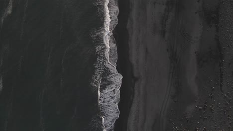 Waves-crashing-on-black-sand-beach-in-Iceland