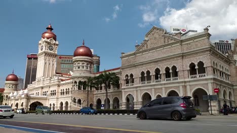 Timelapse-of-Dataran-Merdeka-traffic-with-Sultan-Abdul-Samad-Building-at-Merdeka-Square-with-bright-blue-sky