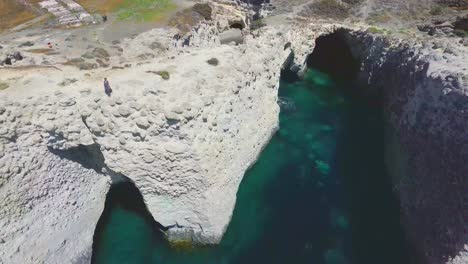 Aerial-view-of-Cliffs-and-beach-in-Papafragas-beach,-Milos,-Greece