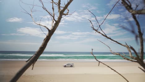 Lonely-car-traveling-on-wild-national-beach-Sodwana-Bay-South-Africa