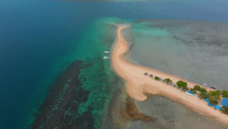 Aerial-drone-shot-of-an-Island-with-beautiful-blue-waters