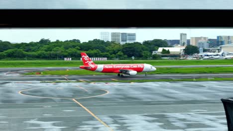 An-Air-Asia-passenger-plane-taxies-toward-the-runway-to-get-ready-for-takeoff