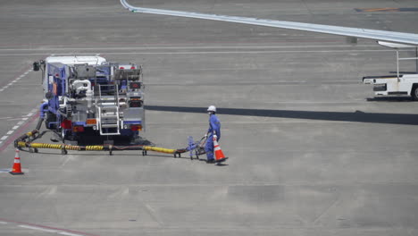 Ground-Crew-Working-At-Refueling-Site