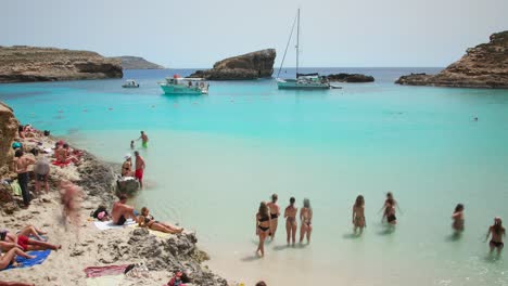 Tourists-And-Boats-In-Blue-Lagoon-Of-Comino-Island-In-Malta-At-Summer
