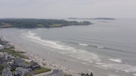 Drone-flying-over-crowd-of-people-at-Higgins-Beach-in-Maine