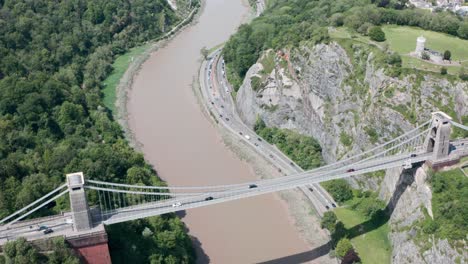 Dolly-forward-pan-down-drone-shot-over-Clifton-Suspension-bridge-Bristol