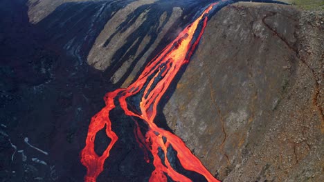 Aerial-view-of-a-Huge-Stream-of-Lava-flowing-down-the-mountain-near-Fagradalsfjall-volcano-in-Iceland