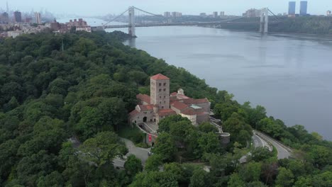 Downward-facing-counterclockwise-aerial-orbit-of-The-Cloisters-museum-in-on-the-bank-of-the-Hudson-River-in-NYC