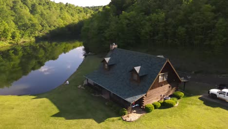 This-is-a-beautiful-shot-of-a-cabin-on-the-side-of-a-private-lake