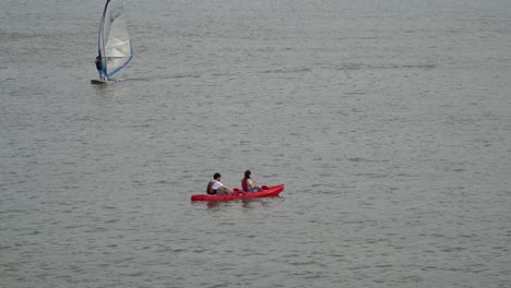Couple-Kayaking-On-Calm-Waters-Of-Han-River-At-Summer-In-Seoul,-South-Korea