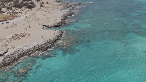 Rocky-coastline-of-Falasarna-beach-in-Crete-island,-aerial-view