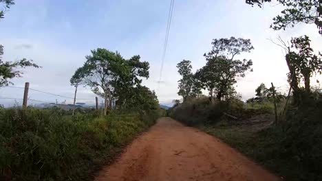 Time-lapse-driving-up-lush-mountainside,-FPV-facing-backwards,-Valle-del-Cauca,-Colombia