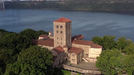 Clockwise-aerial-orbit-of-The-Cloisters-museum-in-crispy-morning-sunshine-on-the-bank-of-the-Hudson-River-in-NYC