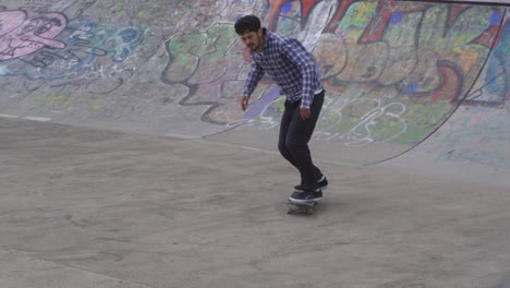 Slow-mo-of-skate-boarder-at-a-skate-park-in-Sheffield,-England