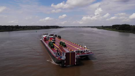 Aerial-Parallax-View-Of-Dynamica-Transport-Barge-Navigating-Oude-Maas-Near-Barendrecht