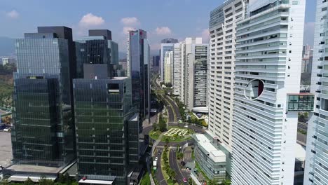 drone-flying-through-Skyscrapers-in-Modern-Mexico-City-Santa-Fe-District,-Mexicana-Park