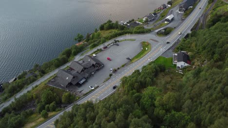 Popular-stopping-spot-Akrafjordtunet-along-E134-outside-Etne-in-Norway---Accomodation-and-restaurant-building-seen-from-birds-eye-perspective-far-up-in-the-mountainside---Rogaland-Norway