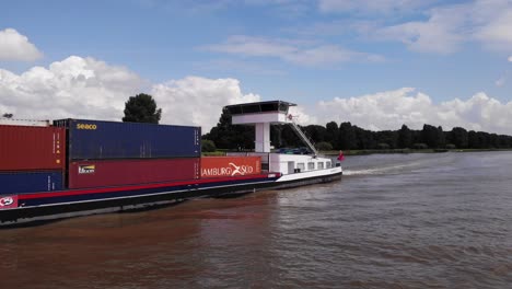 Container-Carrying-Ship-Alsace-Going-Past-On-Oude-Maas