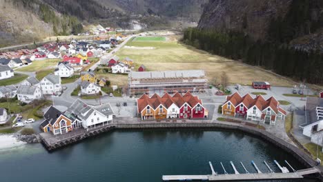 Modalen-town-center-with-a-marina-close-to-houses-and-a-public-beach---Norways-richest-municipality-aerial