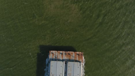 Aerial-establishing-shot-of-large-tanker-boat-in-water
