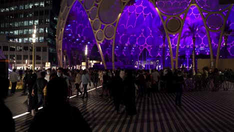 Expo-2020-at-night-near-the-central-pavilion-with-people-enjoying-themselves