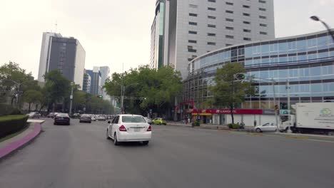 Driving-through-the-streets-of-Mexico's-City-downtown-shot-from-a-car-perspective
