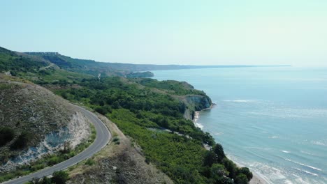 Asphalt-Road-On-Rugged-Shoreline-Of-Heros-Beach-In-The-Town-Of-Balchik,-Black-Sea-Coast,-Bulgaria