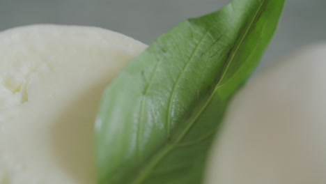 Fresh-Juicy-Italian-Mozzarella-with-a-Basil-Leaf-ready-to-be-served-at-a-Gourmet-Restaurant