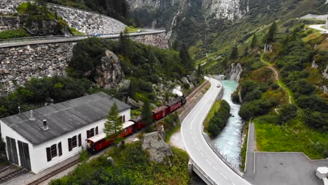 Aerial:-steam-train-along-a-road-and-by-the-Rhone-river