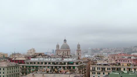 Historical-buildings-of-Genoa-on-moody-cloudy-day,-drone-cinematic-ascend-view