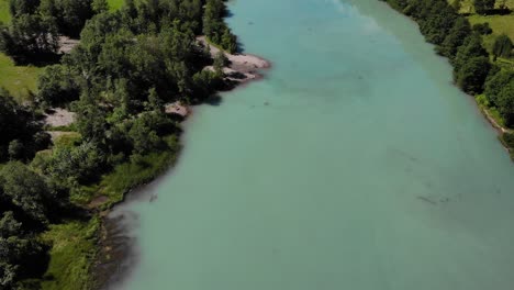 Aerial-View-Of-Calm-Turquoise-Lake-Water-In-Klammsee,-Kaprun,-Austria---drone-shot