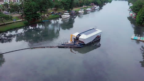 Parallax-Aerial-Shot-of-Interceptor-River-Cleanup-Robot-in-Cengkareng-Drain-River