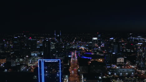 Nashville-Night-Time-Aerial-looking-over-broadway-downtown-city,-Drone-4K